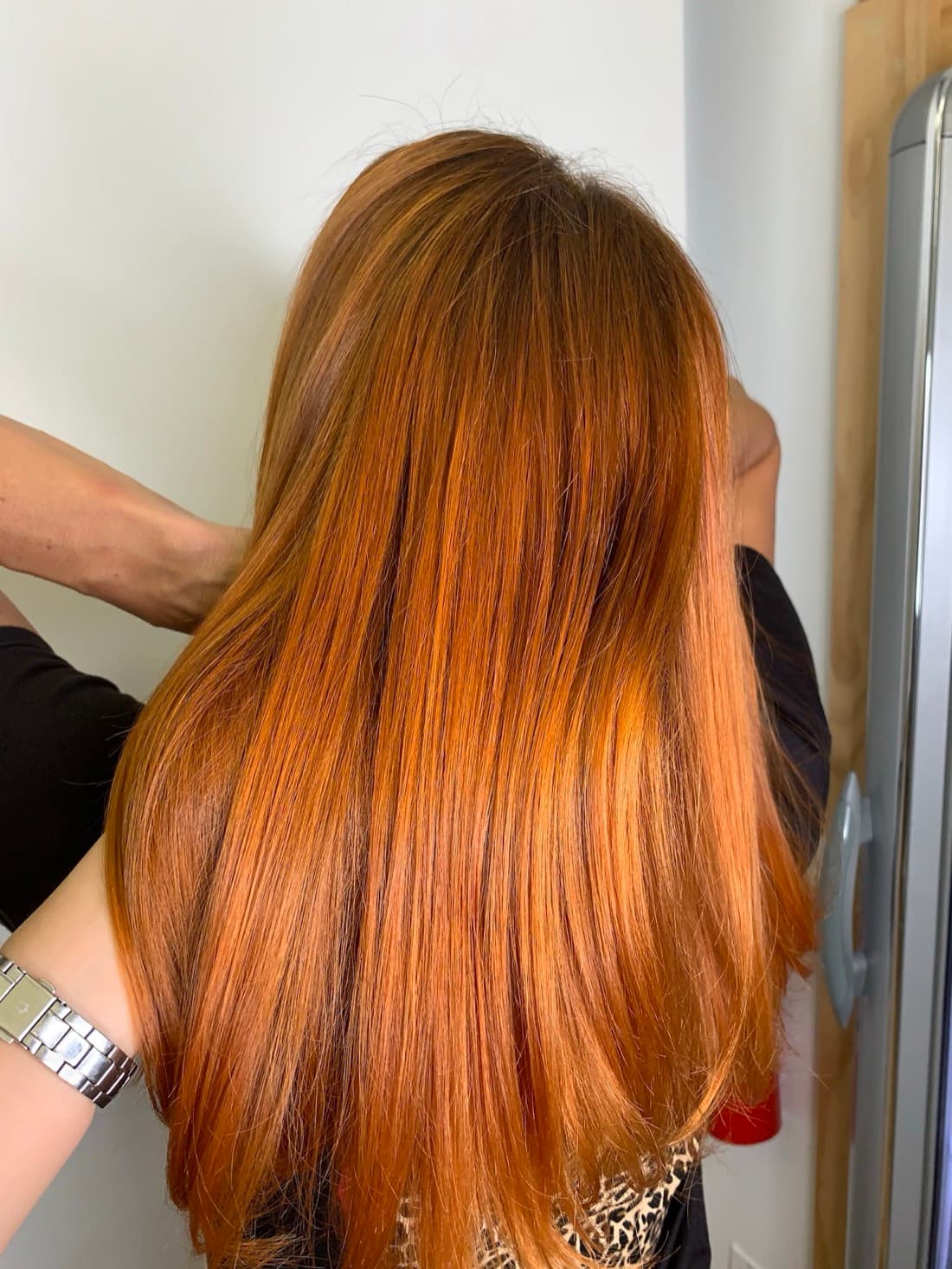 Sleek copper hair coloring with a glass-smooth blowout finish, by a South Beach colorist at McAllister Spa