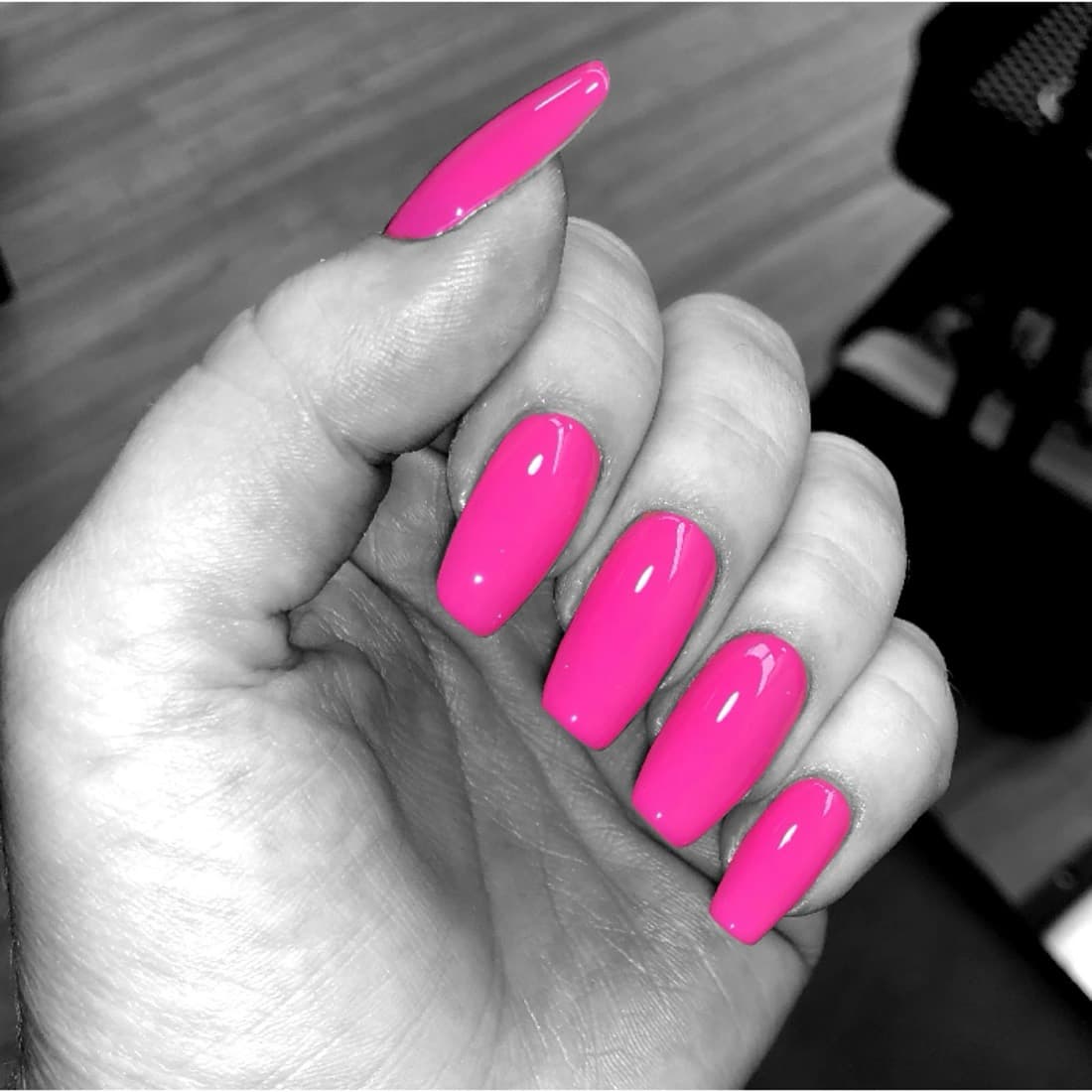 Hot pink gel manicure on almond nails from McAllister Spa's nail salon in Miami Beach