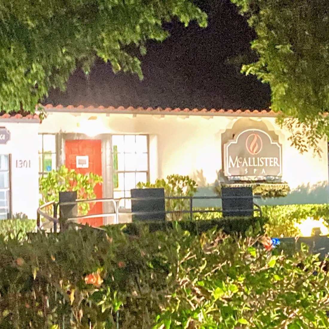 McAllister Spa's historic beauty salon building lit at night on Alton Road in Miami Beach's Flamingo neighborhood