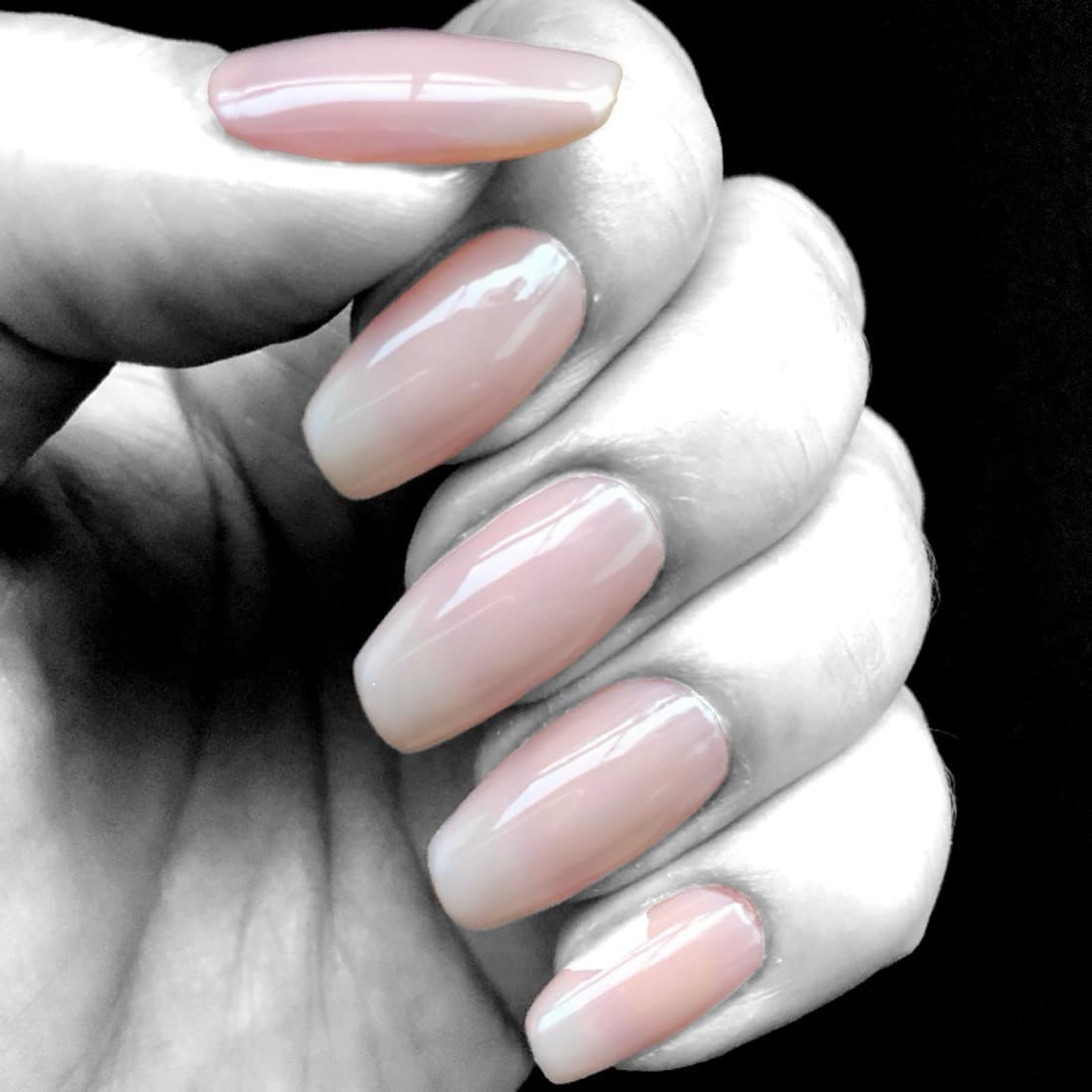 Natural pink ombre manicure with a clean, glossy finish by Miami Beach nail technicians at McAllister Spa