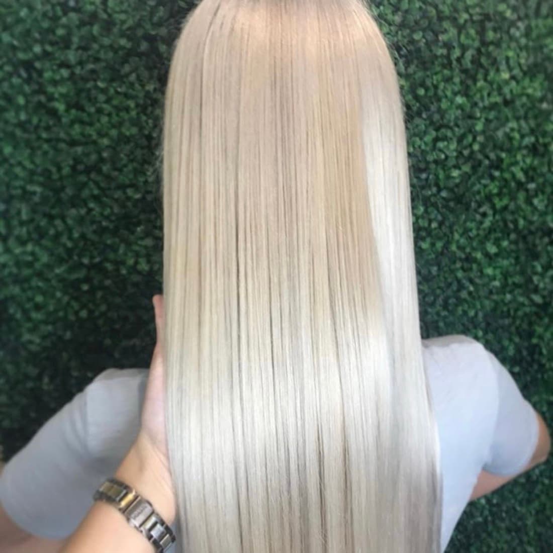 Platinum blonde hair after a keratin smoothing treatment at McAllister Spa's Miami Beach hair salon