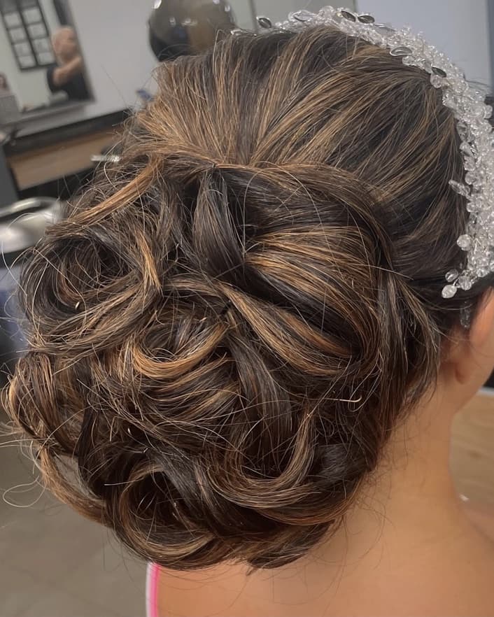 Bridal updo with caramel-highlighted twists and a crystal headband, styled at McAllister Spa in Miami Beach