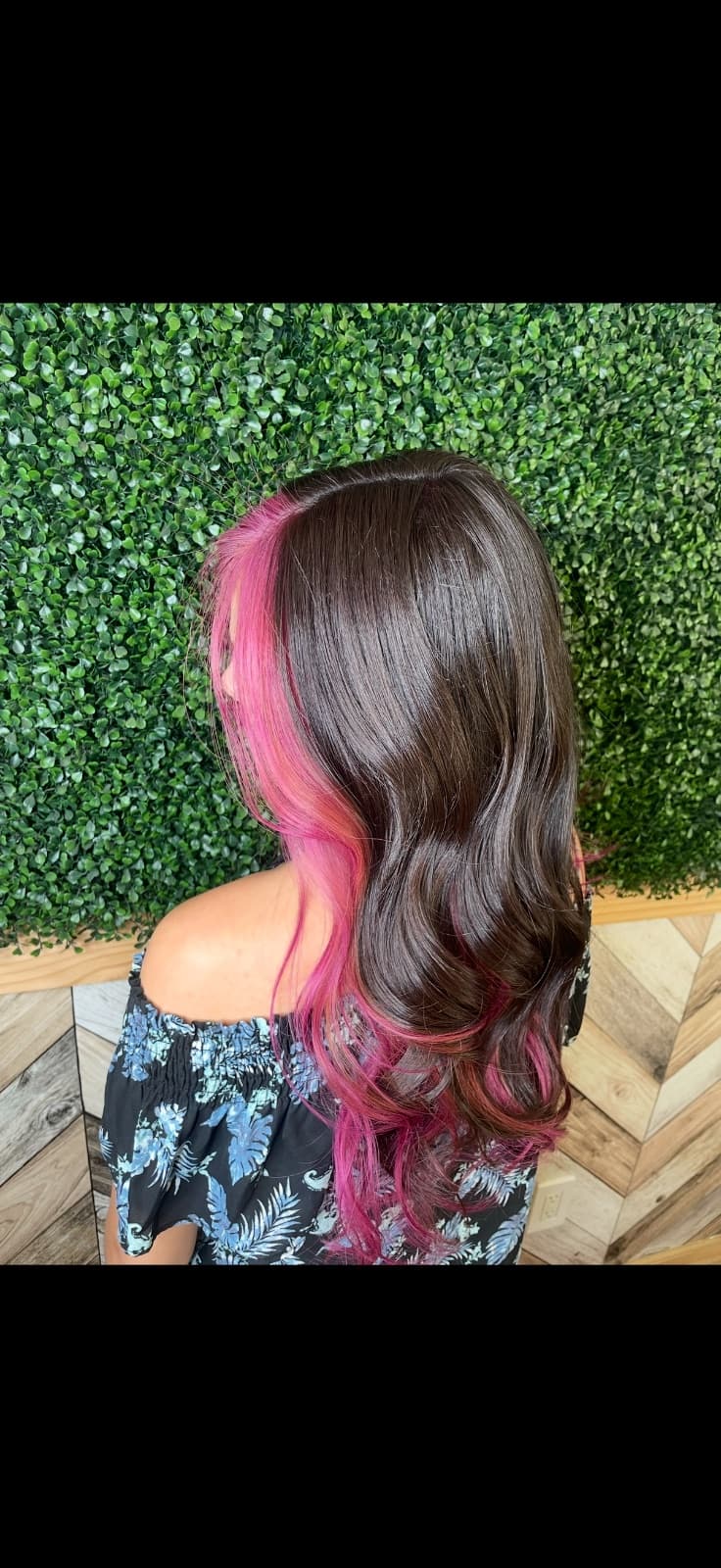 Brunette hair with vivid pink peekaboo panels and loose waves, creative hair coloring at McAllister Spa in South Beach