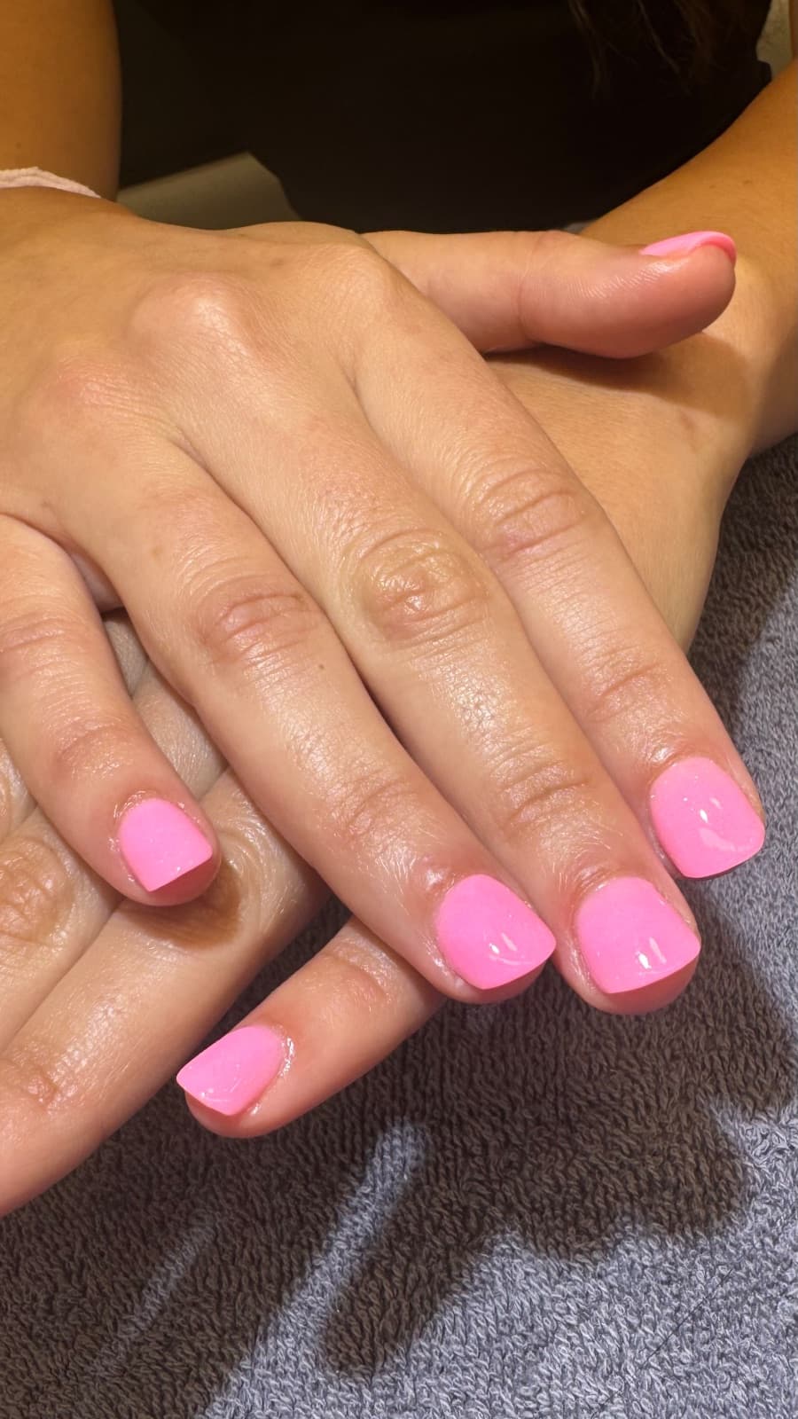 Short square bubblegum-pink shimmer manicure by Marnie at McAllister Spa in Miami Beach